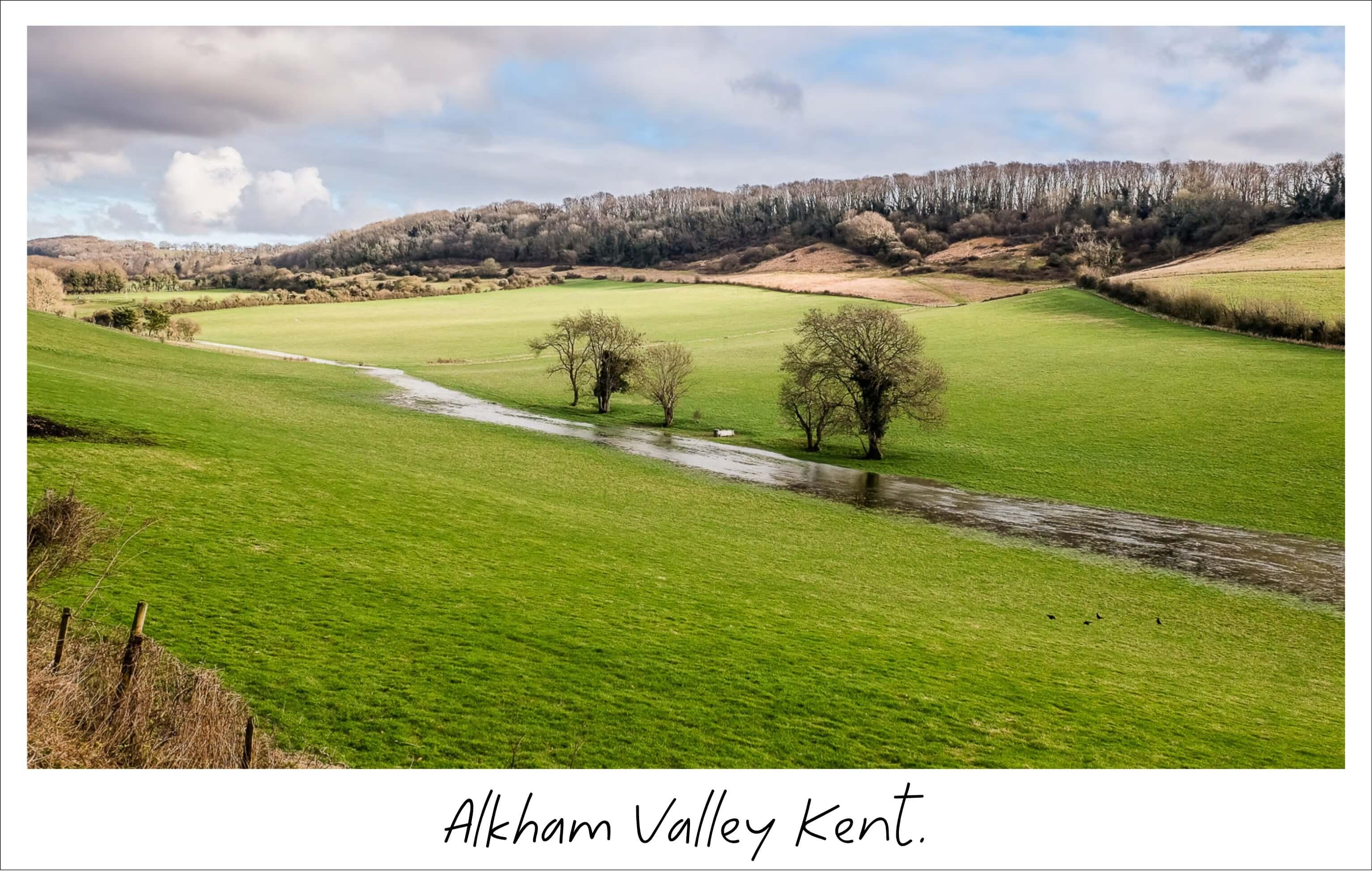 Alkham Valley. The winterbourne stream the Drellingore is in full flow, winding it's way along the valley floor.