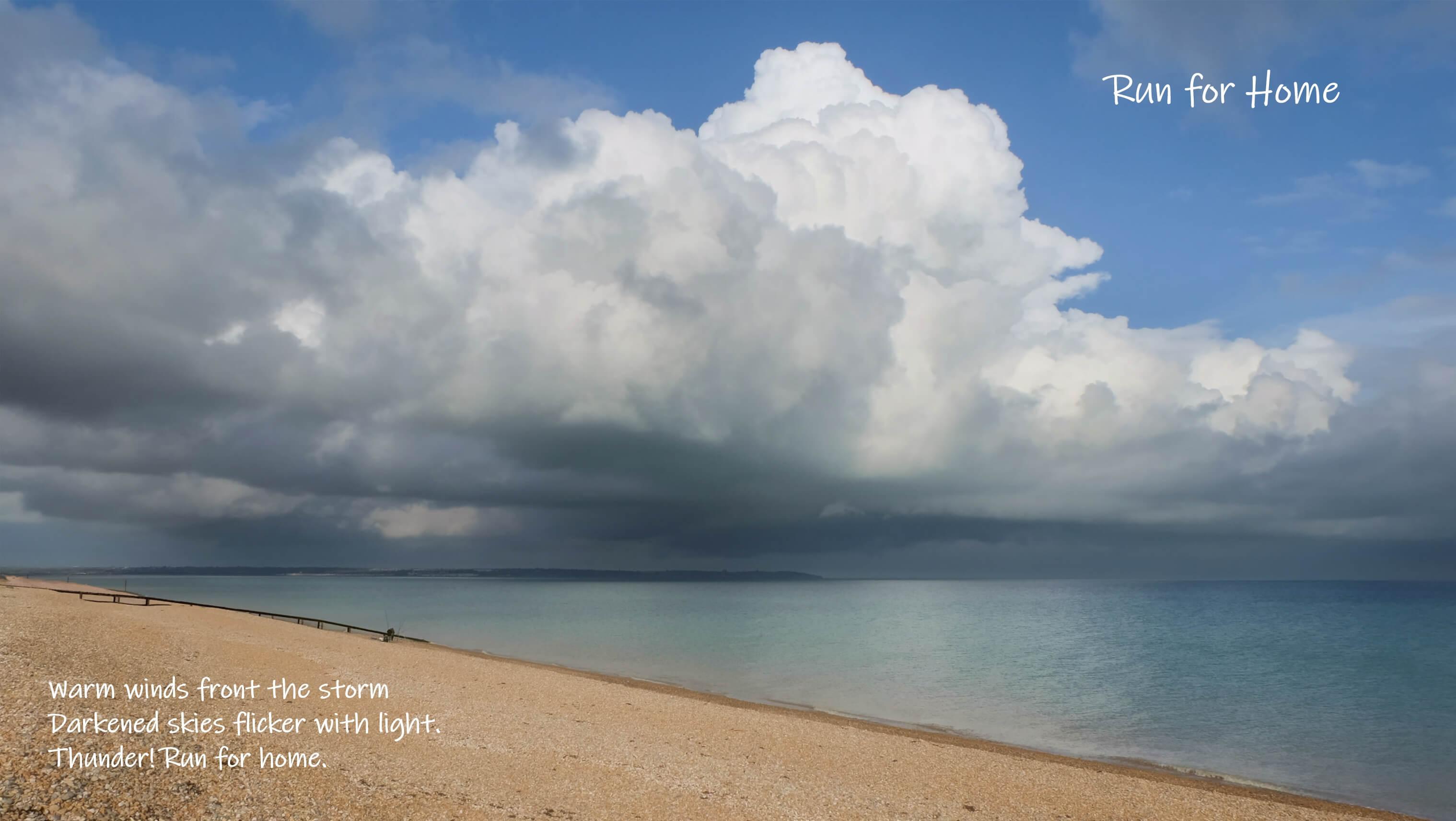 Towering storm could gather over a pebble bay.